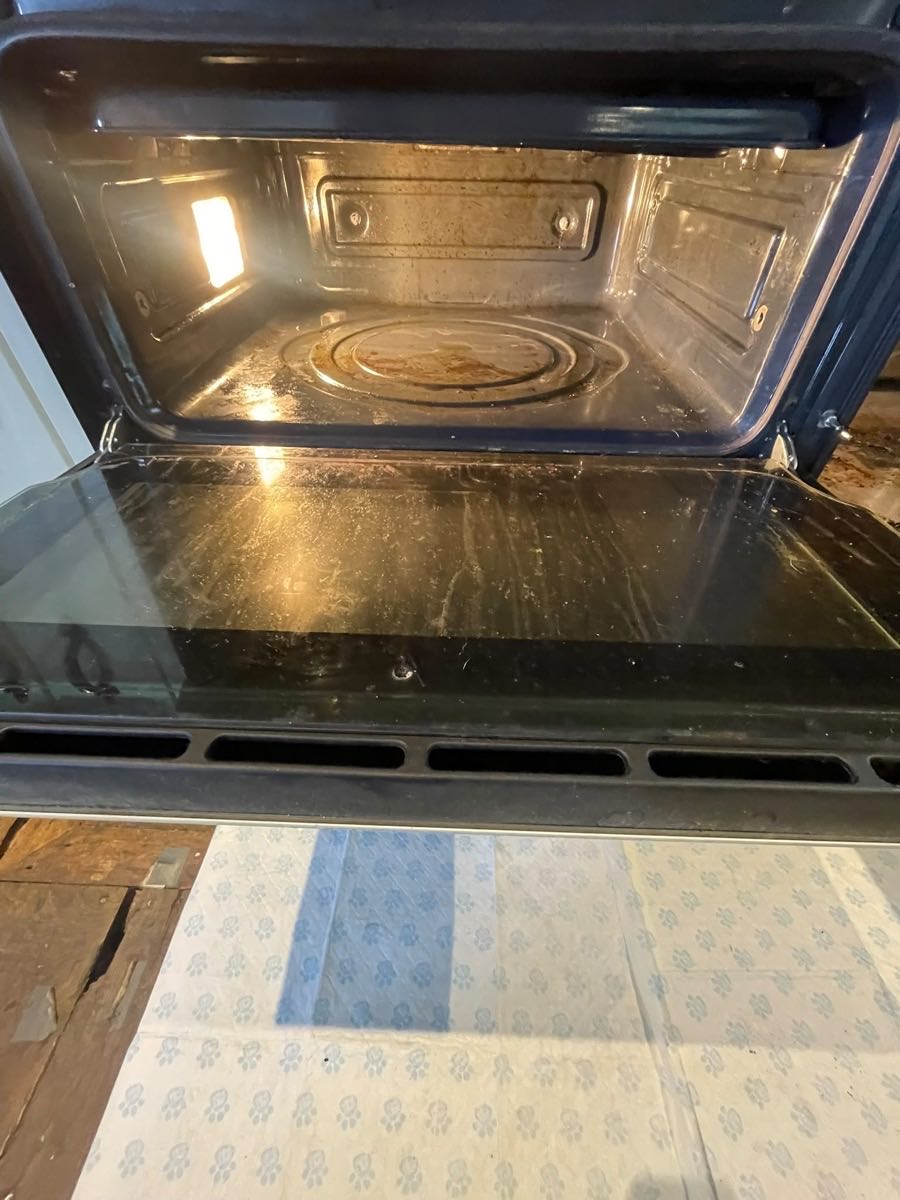 The inside of an oven after cleaning, door open
