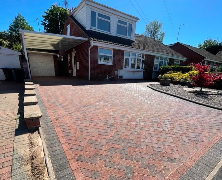 The same driveway after cleaning, red and charcoal block paving sharp again