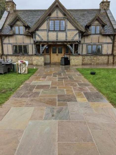 The same sandstone path after cleaning, colour back in the stone
