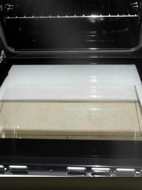 The same oven after cleaning, base and door glass clear
